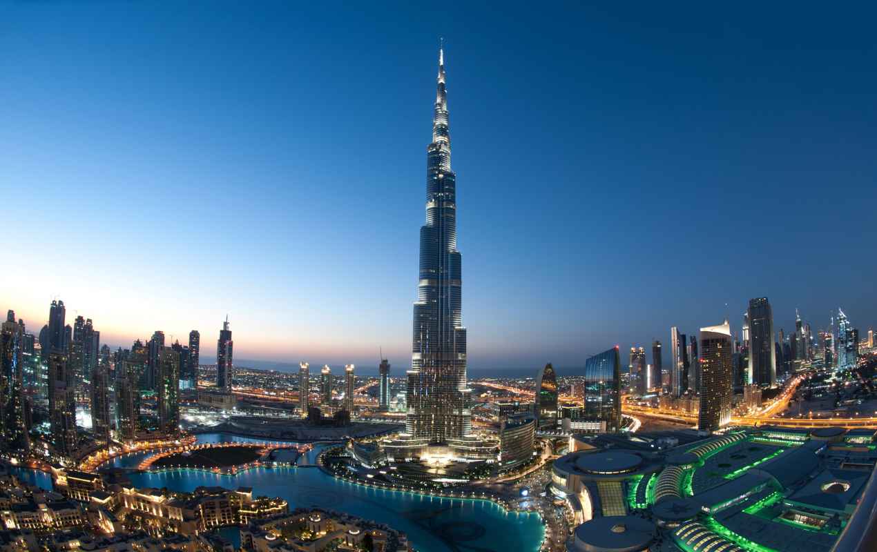 View of Burj Khalifa and Dubai's cityscape after sunset.