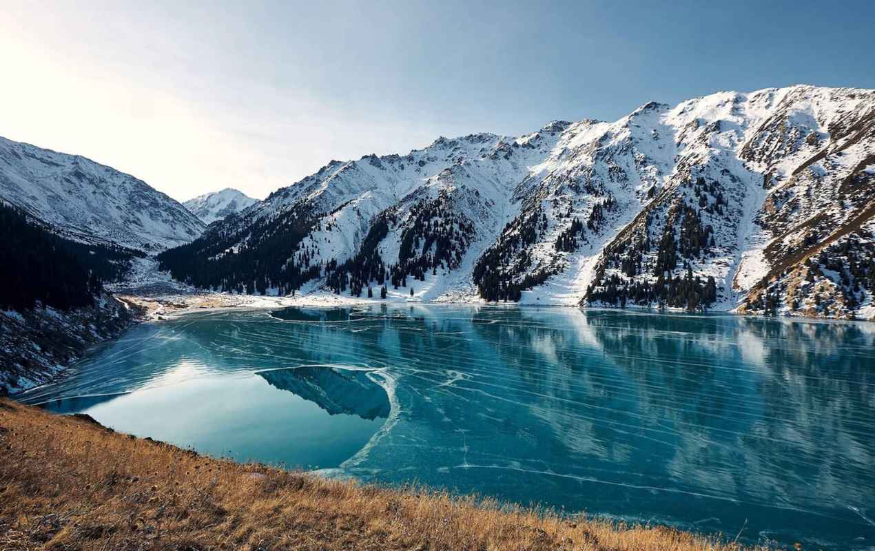 Frozen Big Almaty Lake in winter. Kazakhstan