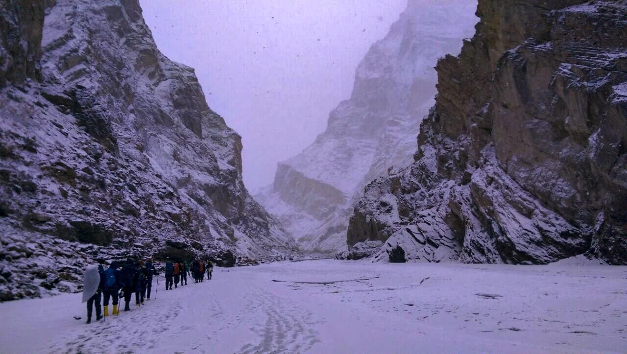 Trekkers on Chadar Trek during snowfall