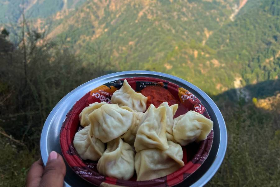 A plate of steaming Momos