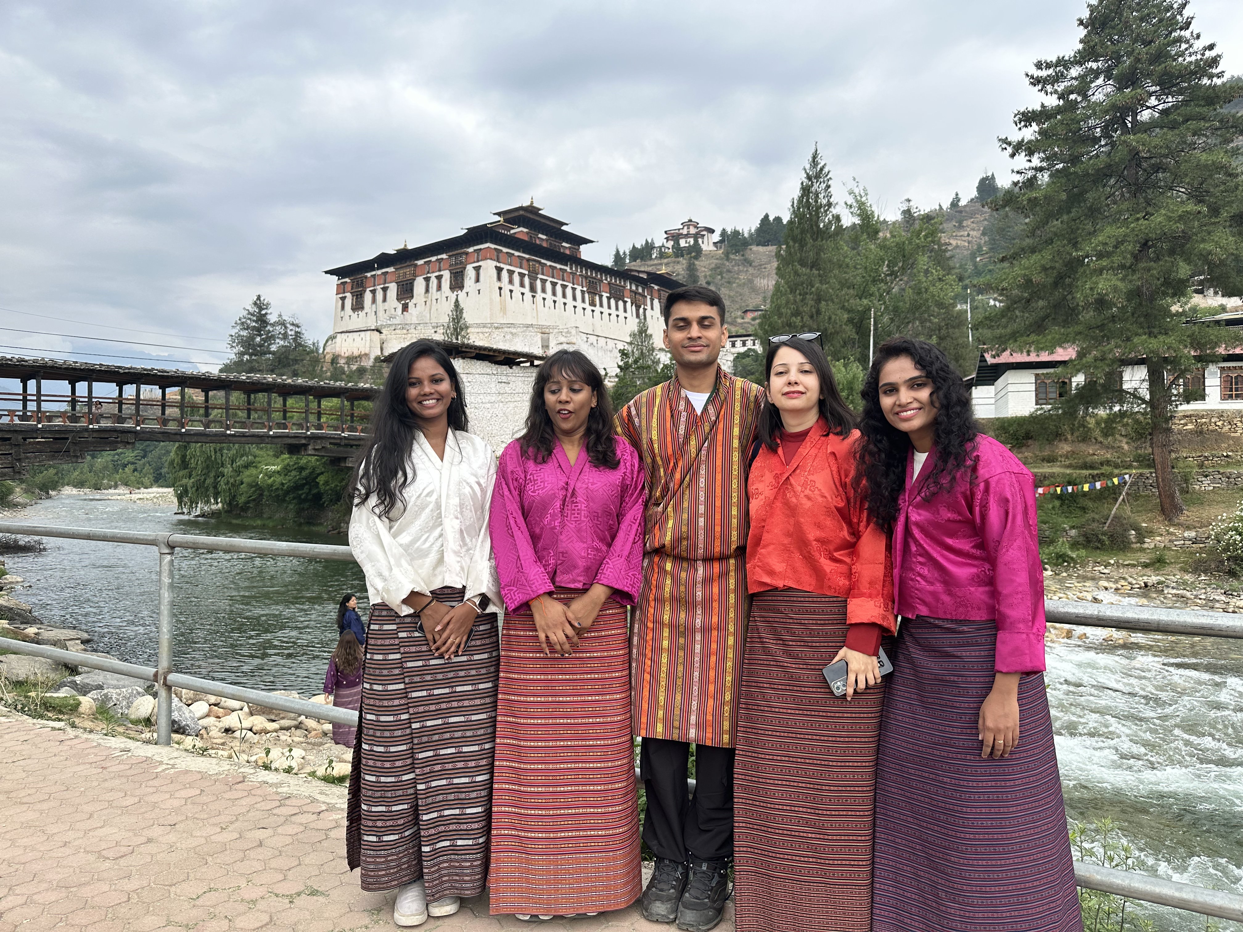 Friends posing in the traditional attires of Bhutan