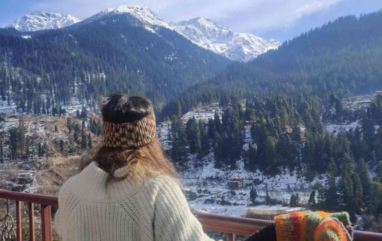 Girl enjoying the breathtaking views on Himachal trip