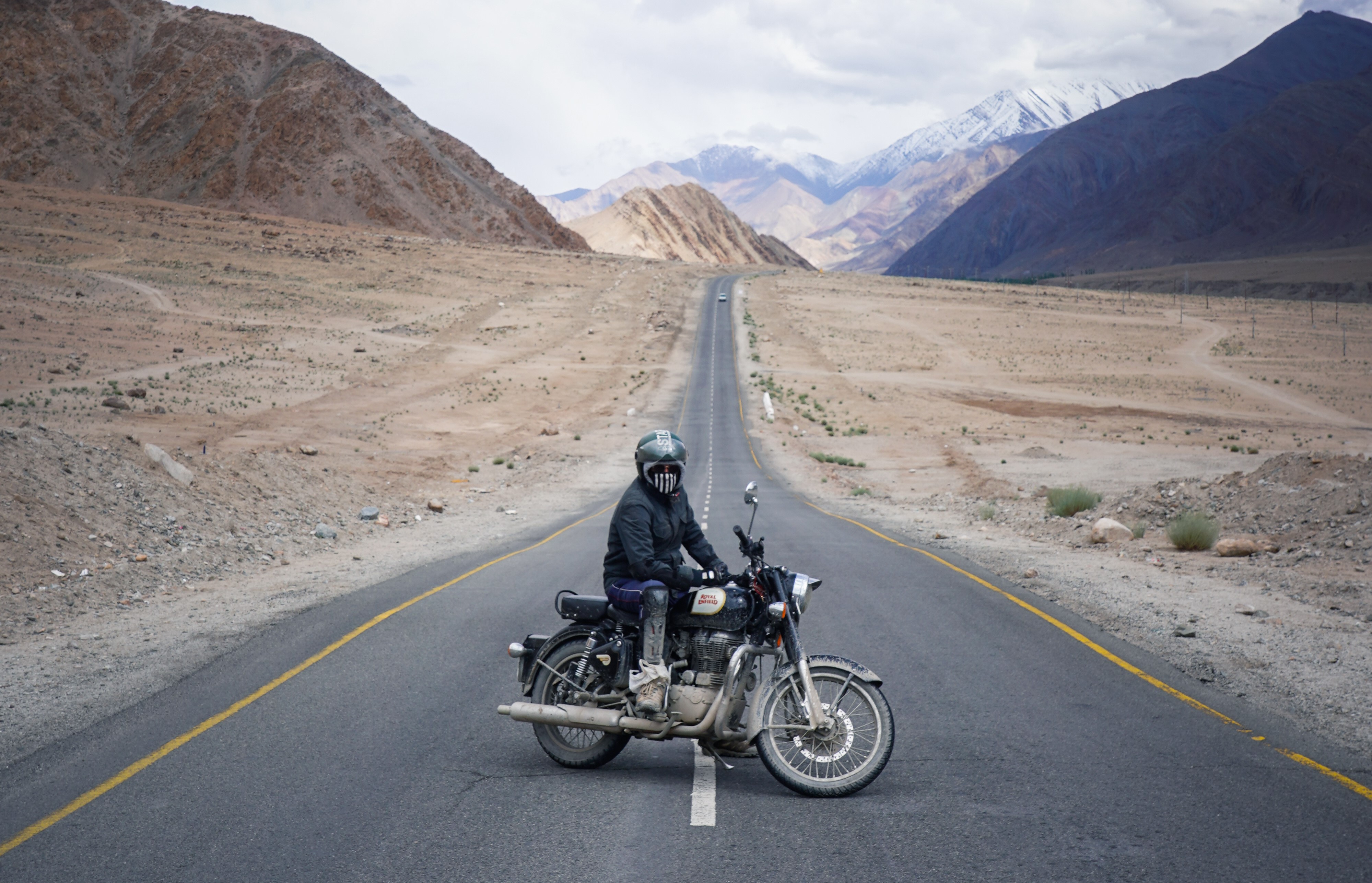 Biker Posing At The Beautiful Straight Road Enroute Leh