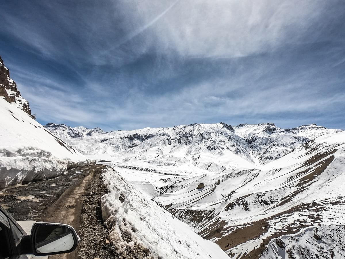 Snow Covered Peaks And Path